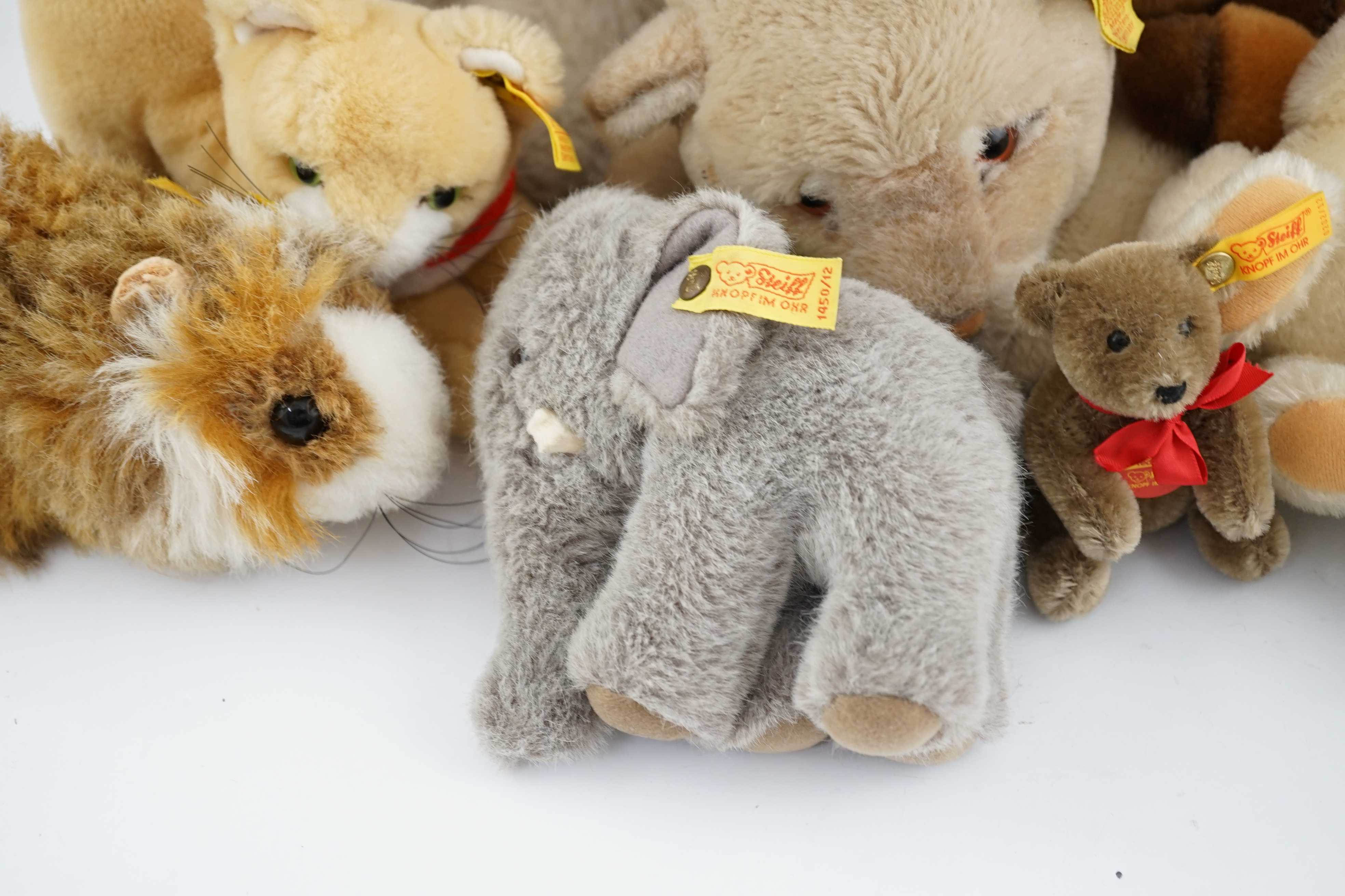 Ten assorted Steiff yellow tag animals, two yellow tag bears, together with Steiff catalogues